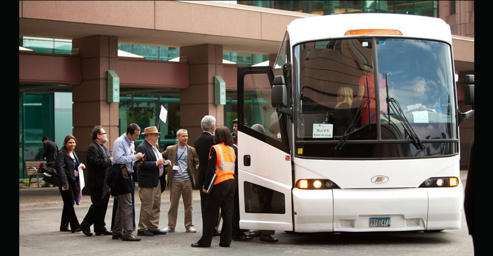 people boarding coach bus