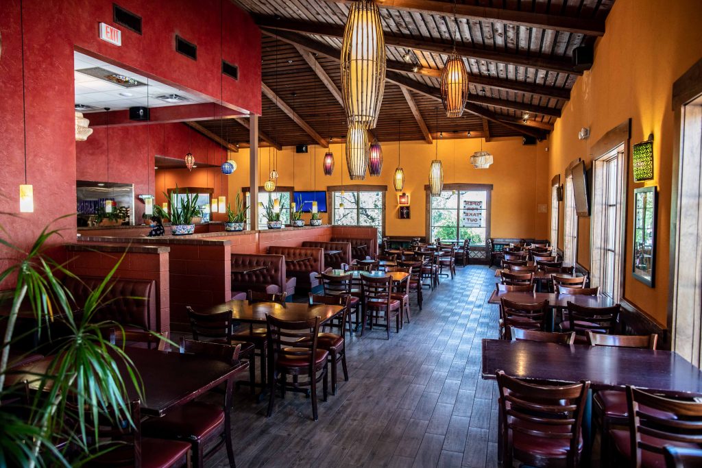 Mexican restaurant bar with brown tables and chairs